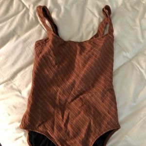 solid and striped one piece bathing suit